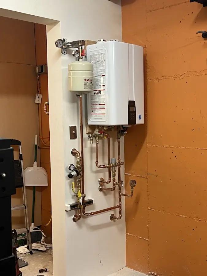 Plumbing technician inspecting water heater connections in Santee